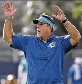  ?? ASSOCIATED PRESS 2016 ?? Clyde Christense­n says the Dolphins’ track record shows they will help former line coach Chris Foerster (above): “I don’t think anyone will kick him to the curb.”