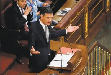  ?? Juan Carlos Hidalgo / AFP / Getty Images ?? Socialist Party leader Pedro Sanchez may become Spain’s new leader under a law that prevents a power vacuum. Sanchez, 46, called on Prime Minister Mariano Rajoy to step down over a kickbacks scandal.