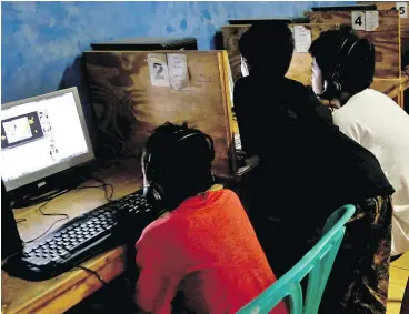  ?? —APFILES ?? Youths at an internet café in Jakarta, Indonesia: Children’s advocates worry about the tech industry’s use of persuasive psychologi­cal tactics on young people, citing a link between excessive screen time and depression and academic struggles.
