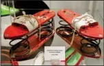  ?? Arkansas Democrat-Gazette/JOHN SYKES JR. ?? Shoes on display at the Esse Purse Museum in downtown Little Rock include a whimsical spring-loaded pair from the 1960s.