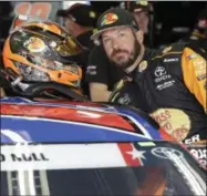  ?? CHUCK BURTON - THE ASSOCIATED PRESS ?? Martin Truex Jr. climbs into his car before practice for Sunday’s NASCAR Coca-Cola 600Cup series auto race at Charlotte Motor Speedway in Concord, N.C., Thursday, May 23, 2019.