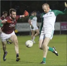  ??  ?? Brendan Doyle (St. James’) kicks as Daithí Waters attempts to block.