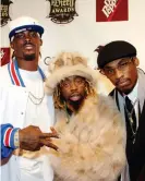  ??  ?? Vick, shown here with the Ying Yang Twins at the 1st Annual Dirty Awards in 2005, became a cross-cultural icon during his time in Atlanta. Photograph: Rick Diamond/WireImage
