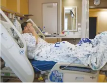  ??  ?? A PATIENT lies in a bed at Hadassah University Medical Center in Jerusalem’s Ein Kerem in February 2014.