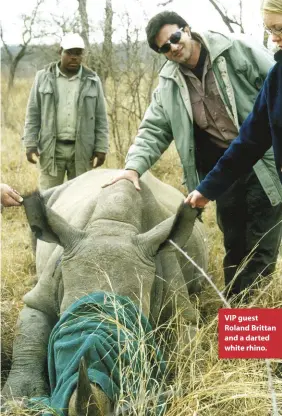  ??  ?? VIP guest Roland Brittan and a darted white rhino.