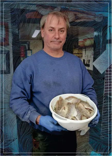  ?? KLEIN/USA TODAY NETWORK-WISCONSIN ?? Paul LeClair holds a bowl of perch fillets this month at Susie-Q Fish market in Two Rivers. LeClair, who is president of the market, said the shortage of perch has driven pricing upward, and most customers have adjusted to the situation.