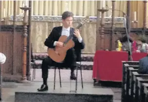  ??  ?? ●●James Girling performing at St Mary in the Baum