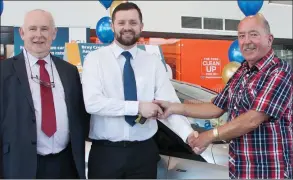  ?? (Photo: Charlie Sharke). ?? Dan Quill, chairman of Bray Credit Union, and John O’Brien from Fitzpatric­k Motors present John Fleming with his car