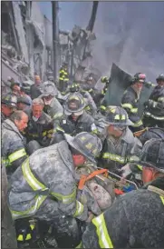  ?? (Newsday/Robert Mecea) ?? A fireman screams in pain as he is rescued shortly after both towers of the World Trade Center collapsed on Sept. 11, 2001.