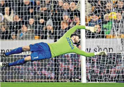  ??  ?? It’s behind you: Leeds goalkeeper Andy Lonergan cannot prevent Barry Douglas’s shot from finding the back of the net