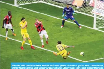  ??  ?? NICE: Paris Saint-Germain’s Brazilian defender Daniel Alves (Bottom R) shoots on goal as (From L) Nice’s French defender Malang Sarr, Paris Saint-Germain’s Uruguayan forward Edinson Cavani, Nice’s French defender Maxime Le Marchand and Nice’s...