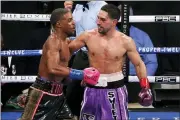  ?? BRANDON WADE - AP ?? Errol Spence Jr. and Danny Garcia, right, talk after their WBC and IBF welterweig­ht championsh­ip boxing bout in Arlington, Texas, Saturday.