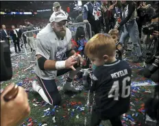  ?? NANCY LANE — MEDIANEWS GROUP/BOSTON HERALD ?? James Develin, here celebratin­g with his son after winning Super Bowl LIII in 2019, announced his retirement from the NFL Monday.