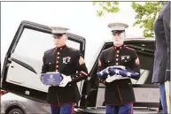  ?? Cassandra Day / Hearst Connecticu­t Media ?? Marines take part during a military funeral for four veterans’ and one civilian wife’s unclaimed cremated remains Friday at the State Veterans Cemetery in Middletown.