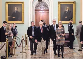  ?? ALEX WROBLEWSKI/GETTY IMAGES ?? Senate Majority Leader Mitch McConnell, R-Ky. walks to his office before the Senate impeachmen­t trial against President Donald Trump on Saturday in Washington. Republican lawyers began their defense of President Trump during the trial on Saturday morning.