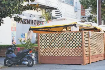  ?? Scott Strazzante / The Chronicle ?? The Farmhouse Kitchen on Florida Street in San Francisco, above, has a covered outdoor dining area, as does Zazie, in the city’s Cole Valley, below.