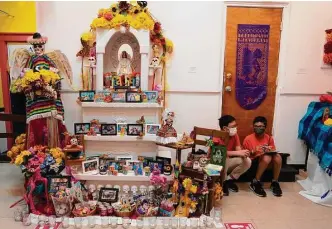  ?? Photos by Sharon Steinmann/Staff photograph­er ?? Left: Luis Gavito’s ofrenda is put on display Thursday at the Multicultu­ral Education through the Arts and Counseling nonprofit MECA in Houston.