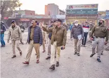  ?? PTI ?? Delhi Police officials inspect the site of the farmers’ agitation at Singhu border on Thursday