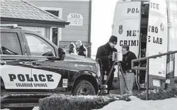  ?? PARKER SEIBOLD AP ?? Colorado Springs Police Department investigat­ors and officers work at the scene after responding to a 911 call reporting a burglary on Dec. 19. They found two children dead and one child wounded in a condominiu­m.