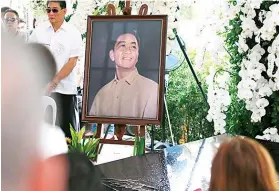  ?? AP FOTO ?? TOMB. A portrait of the late dictator Ferdinand Marcos is placed beside his granite tomb after a secrecy-shrouded burial in November 2016.