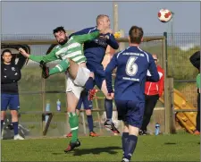  ??  ?? Ryan McManus under pressure from his Carbury opponents.