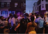  ?? JOE LAMBERTI ?? Police officers gather for crowd control as a shooting is investigat­ed, Wednesday, Aug. 14, 2019, in Philadelph­ia.