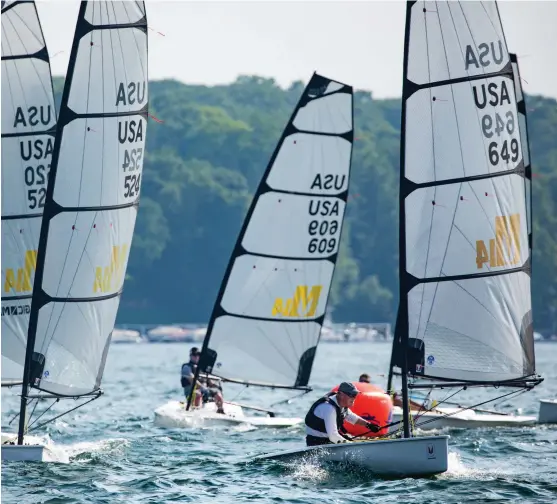  ??  ?? The Melges 14’s fine forward sections and powerful, squarehead­ed mainsail provide plenty of downwind driving force, and with sail controls led to either side, it’s easy to set up the fully battened sail for the next leg. PHOTO: HANNAH LEE NO LL