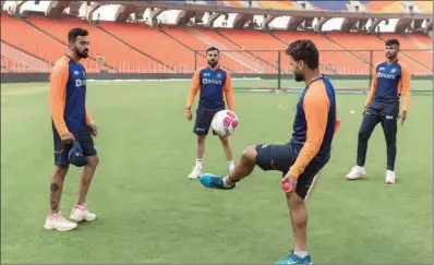  ?? (Pic: BCCI) ?? India captain Virat Kohli (2nd left) and teammates play football ahead of a training session on the eve of the third Test against England at the Sardar Patel Stadium in Motera, near Ahmedabad, on Tuesday.