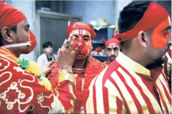  ?? ?? A MAKEUP session of the Bajrangi Sena before it sets out to the various temples in the area.