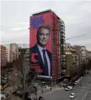  ??  ?? The giant electoral poster of Joan Laporta is displayed on a building next to the Santiago Bernabeu in Madrid. Photograph: Óscar del Pozo/AFP/Getty Images