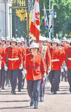  ?? — AFP photo ?? Couto (front) leads her battalion to makes history as the first woman to command the Queen’s Guard at Buckingham Palace.