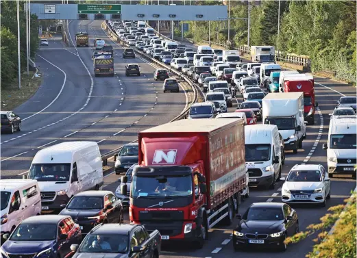  ?? ?? Nightmaris­h commute: Traffic backs up on the A102 approach to the Blackwall Tunnel in Greenwich, south-east London