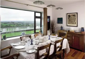  ??  ?? Top right The walnut table matches the walnut floor in the formal dining room, which also has great views of the surroundin­g countrysid­e. The lighting over the table is from SGD Lighting in Ashbourne, where Terry looks after admin and human resources