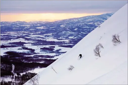  ?? Photo for The Washington Post by Dina Mishev ?? A skier descending a volcano near Shikotsu-Toya National Park. There are numerous ski resorts and opportunit­ies for backcountr­y skiing around Niseko, on the island of Hokkaido in northern Japan.