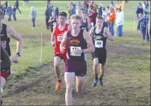  ?? The Sentinel-Record/Richard Rasmussen ?? LEADING THE PACK: Lake Hamilton senior Colby Swecker runs during the Class 5A state boys’ cross country race at Oaklawn Park Friday. Swecker finished third in the race to lead the Wolves to their sixth-straight state title.