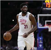  ?? MATT SLOCUM — THE ASSOCIATED PRESS ?? Joel Embiid dribbles Sunday night during a 53-point outing in a 131-113win over Charlotte.