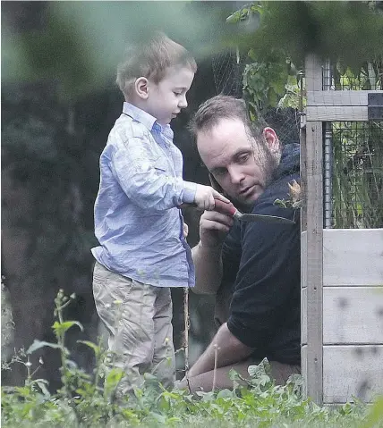  ?? — THE CANADIAN PRESS ?? Joshua Boyle and his son Jonah at his parents house in Smiths Falls, Ont., on Saturday. Boyle, his wife Caitlan Coleman, and two other children were held hostage for five years.