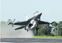  ?? SAM YEH / AFP / GETTY IMAGES FILES ?? An F-16 jet fighter of the Taiwan air force takes off from a highway in an exercise simulating an attack from China.