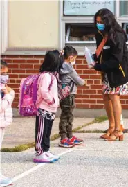  ??  ?? Students arrive for the first time since the start of the coronaviru­s disease at Hunter’s Glen Junior Public School, part of the Toronto District School Board (TDSB) in Scarboroug­h, Ontario, Canada, yesterday.