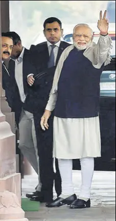  ?? PTI ?? Prime Minister Narendra Modi flashes the victory sign at Parliament in New Delhi on Monday.