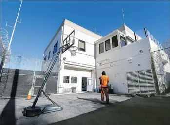  ?? Allen J. Schaben Los Angeles Times ?? AN INMATE stands in the recreation yard at the Seal Beach Detention Center. Seal Beach’s pay-to-stay program generates more revenue than any other city in L.A. and Orange counties, records show.