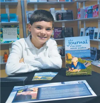  ?? – Acadie Nouvelle: David Caron ?? Alexis Bourque, au Salon du livre de la Péninsule acadienne, à Shippagan.