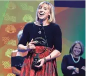  ?? JEFF ZELEVANSKY, GETTY IMAGES ?? Katie Ledecky accepts her award for female athlete of the year during the 2016 Golden Goggle Awards.