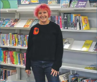  ?? 01_B35library­01 ?? Library assistant Nickey Summer is looking forward to welcoming visitors back to the Arran Library.