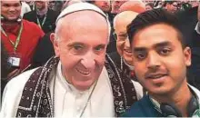  ?? AFP ?? Daniel Bashir takes a selfie with Pope Francis during a youth conference in Vatican City.