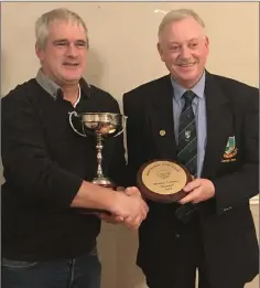  ??  ?? Winter League winner Dan Leigh receives the cup from Club Captain Martin Hennessy at the Baltinglas­s Golf Club presentati­on evening.