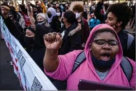  ?? (AP/Star Tribune/Richard Tsong-Taatarii) ?? “What they did to George Floyd was terrible,” said Shawna Harris, one of the protesters who marched in downtown Minneapoli­s on Monday to call for the conviction of former police officer Derek Chauvin.