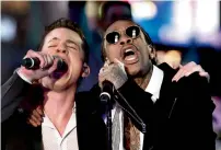  ?? AFP ?? Charlie Puth and Wiz Khalifa perform during a New Year’s Eve event in Times Square in New York. —