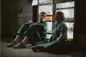 ?? JoJo Whilden / Associated Press ?? This image released by Netflix shows Eddie Redmayne and Jessica Chastain in a scene from “The Good Nurse.”