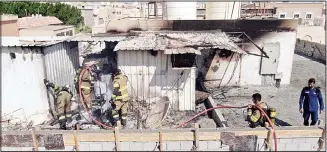  ?? KFSD photo ?? Fire destroys the prefabrica­ted house built on the roof of a house.